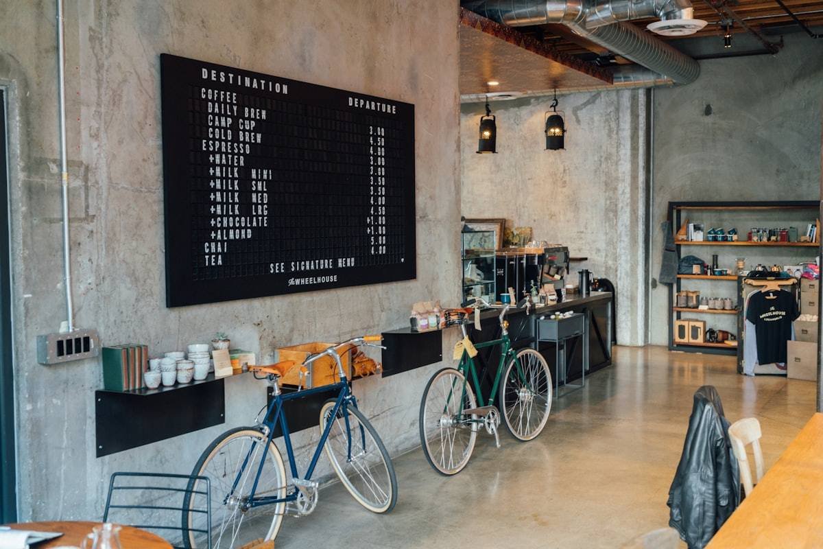 Café counter with menu board and pastries on display
